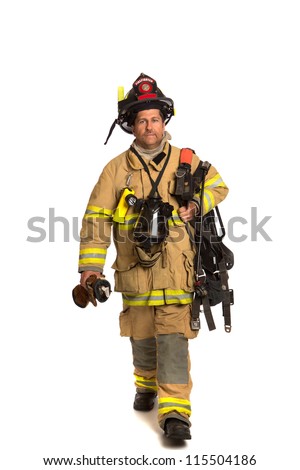 Firefighter holding mask and airpack fully protective suit walking on isolated white background