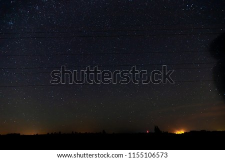 a beautiful night landscape with a starry sky, a milky way, a shooting star, a meteor shower of the Perseid, a wish during the summer cosmic phenomenon
