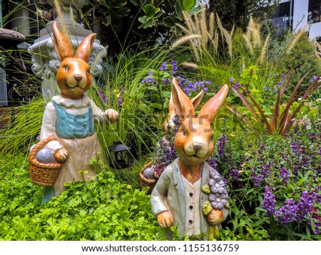 sculptures of rabbit models in the garden
