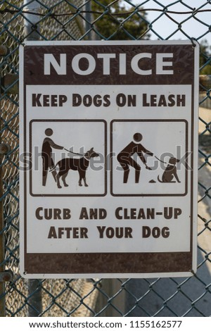 Notice keep dogs on leash warning sign