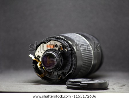 part of camera lens isolated on black background broken camera