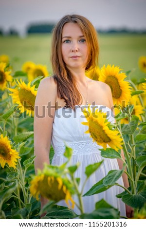 girl in blossoming sunflowers