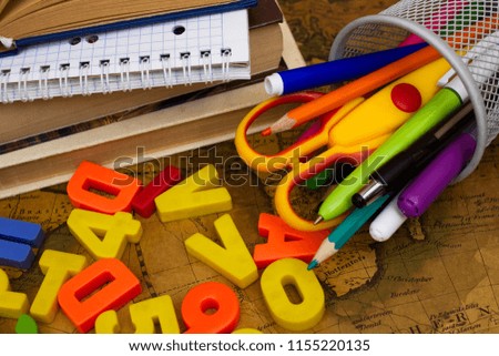 The letters and numbers scattered on the table. Preparation for school