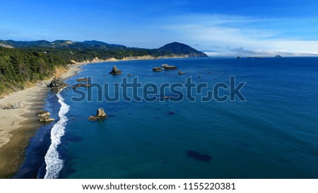 Secluded deserted beach with large rock islands on the Oregon coast