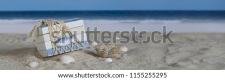 Old wooden crate on the beach, panorama