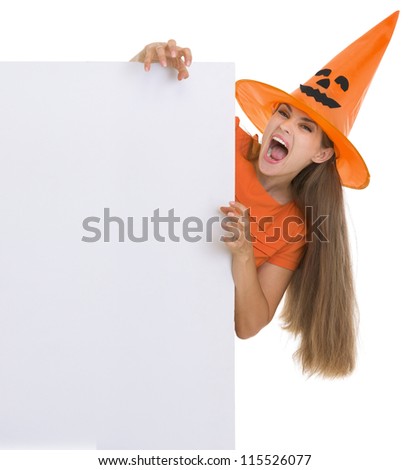 Woman in Halloween hat with blank billboard