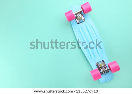 Skateboard on mint background