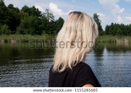 
the girl near the blue lake