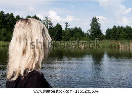 
the girl near the blue lake