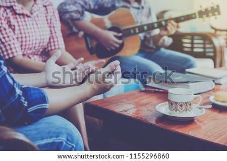 christian family worship God in home with coffee cup, Donut   and holy bible on wooden table  Royalty-Free Stock Photo #1155296860