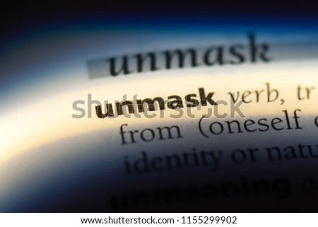 unmask word in a dictionary. unmask concept. Royalty-Free Stock Photo #1155299902