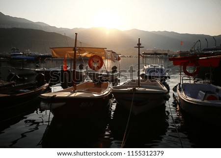 This picture was taken in Budva, Montenegro. It was processed lightly and is a picture of boats resting on Adriatic sea.