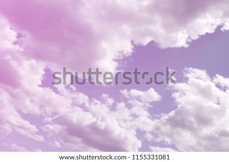 A blue sky with lots of white clouds of different sizes