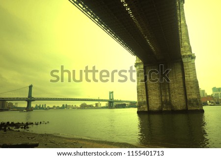 Side and under view of Brooklyn bridge with lighting effect, New York, 