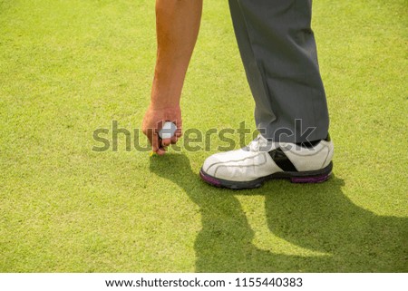 Men with golf balls