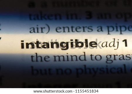intangible word in a dictionary. intangible concept. Royalty-Free Stock Photo #1155451834