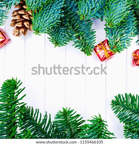 Happy Christmas. Christmas gifts and pine cone on white background. Xmas gift and presents with fir tree branches. Xmas greeting card and border with copy space