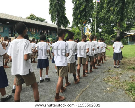 Thai students put a white dress at the morning activity in school