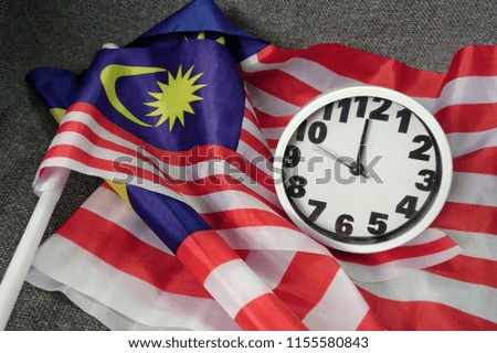 Malaysia Flag and clock. 