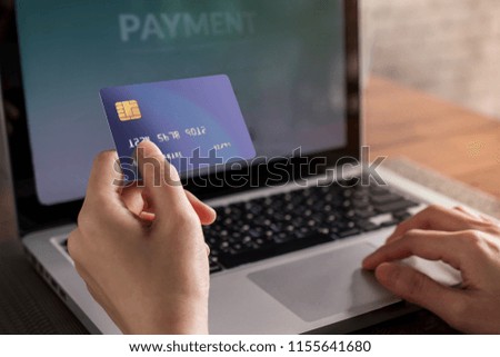 Customer using Credit Card and Computer laptop to Shopping Online. Close-up shot and Selective focus