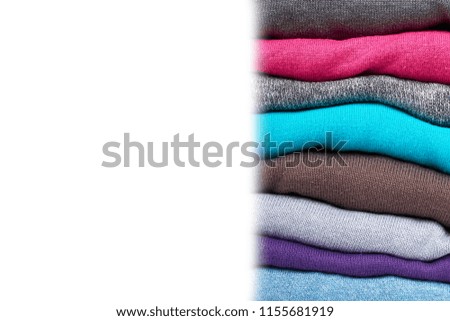 pile of multi color fabric texture, wool cloth isolated on white background, copy space template.