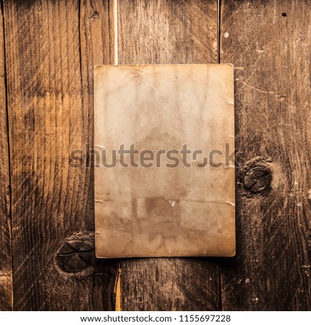 Vintage blank photo on a wooden background