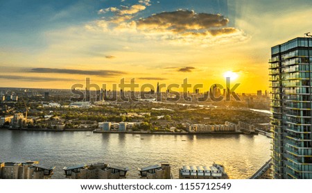 London skyline at sunset including Tower Bridge and skyscrapers