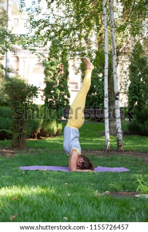 Practicing of yoga outdoors. Practicing yoga with trees, mountains and sun ray in the background