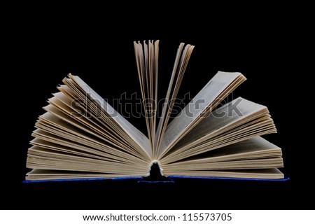 open book isolated on a black background closeup