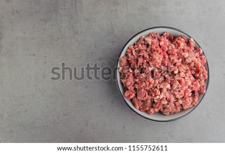 Natural raw ingredients for pet food on grey background. Flat lay. Royalty-Free Stock Photo #1155752611
