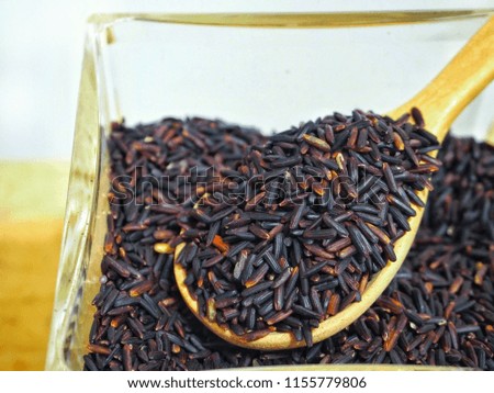 black rice on spoon wood