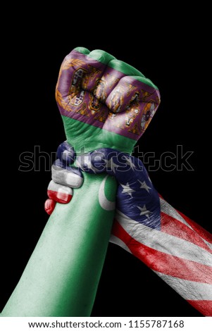 AMERICAN VS Turkmenistan, Fist painted in colors of Turkmenistan flag, fist flag, country of Turkmenistan