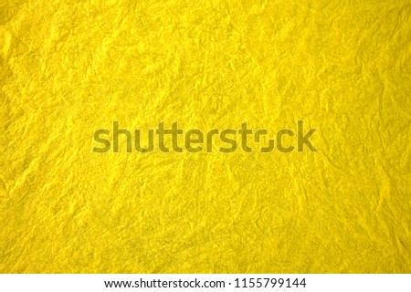 Texture of mint yellow fabric.