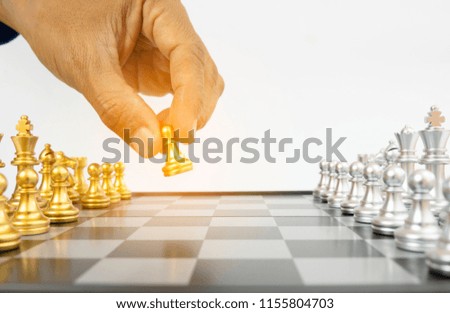 hand holding chess piece
