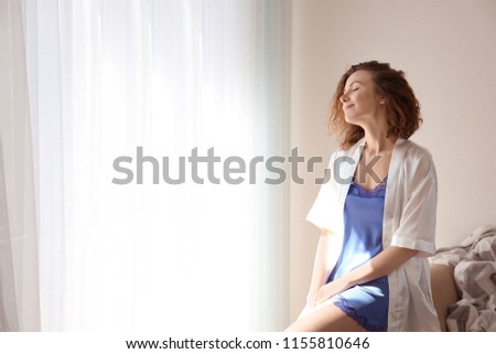 Beautiful woman in morning at home