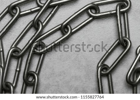 Metal chain on a concrete surface. Major links.