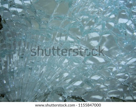 Broken glass with cracks. Texture of glass. Glass background.