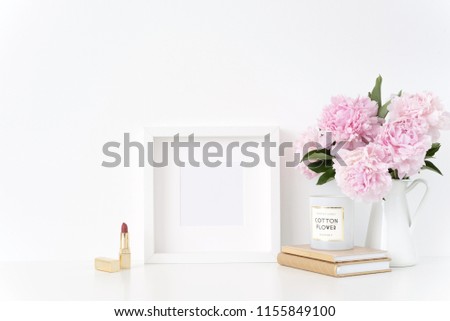 White square blank frame mockup. Feminine still life composition, floral bouquet of pink peonies in vase. Background, mock up for quote, promotion, headline, design, lifestyle bloggers
