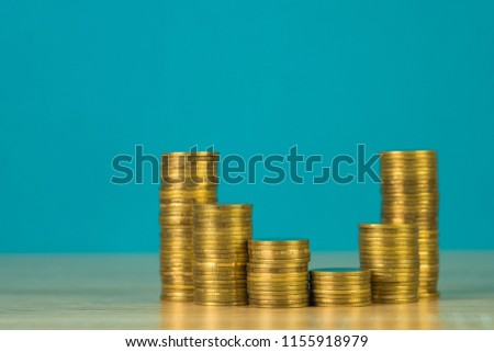 Increasing columns of coins, step of coins stacks on wooden table with copy space for business and financial concept idea.