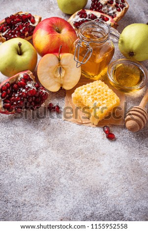 Honey, apple and pomegranate for Rosh Hashana, jewish New Year. Selective focus