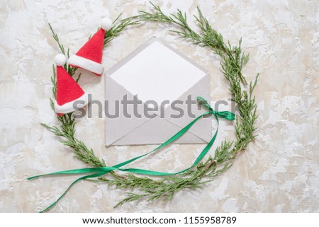 Christmas decorations and objects for mock up template design. Notebook, toy truck and wreath. View from above. Flat lay.