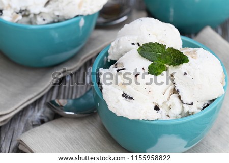 Three bowls of chocolate chip cookie dough ice cream viewed from above. Extreme shallow depth of field with selective focus on bowl in front.