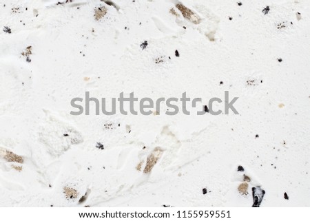 Chocolate chip cookie dough ice cream background viewed from above.