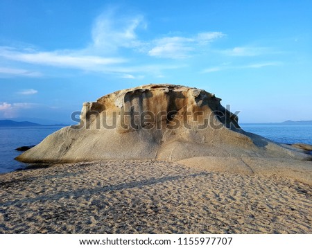 Volcano rock on sandy beach