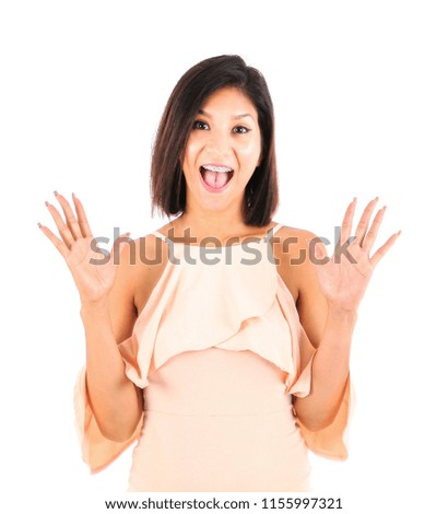 Surprised latin woman posing against a white background