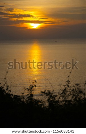 Sunset at the sea with copy space at Chao Lao Beach, Chanthaburi Province, Thailand.