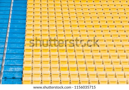 Empty yellow seats at stadium,Rows walkway of seat on a soccer stadium