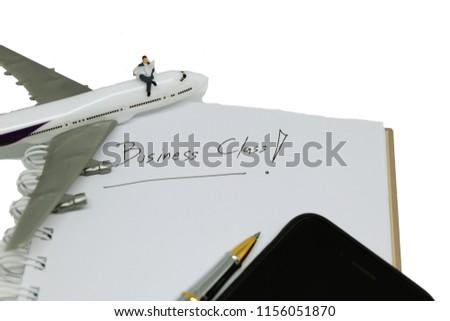 Miniatrue people : Businessman standing on mobie with a plane. picture use for Business concpept and Travel concept.