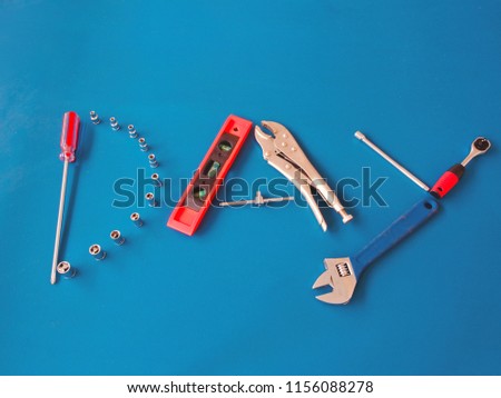 Top view variety handy tools on blue wooden background with copy space for text,Labor day concept