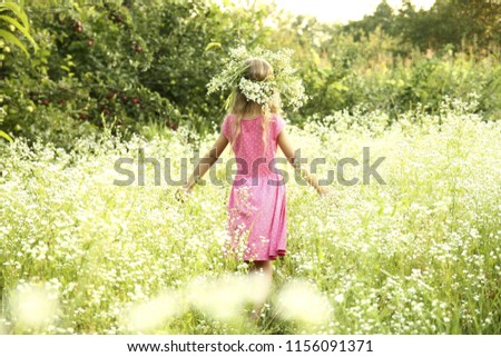 a nice little girl in the nature